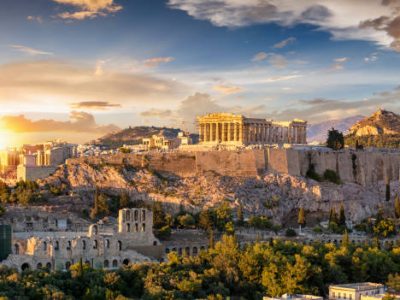 The Acropolis of Athens, Greece, with the Parthenon Temple on top of the hill during a summer sunset