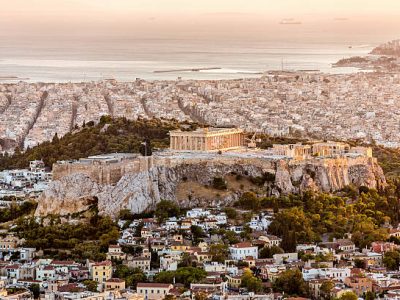 Aerial view over the City of Athens with famous Acropolis at Sunset. Athens, Greece.